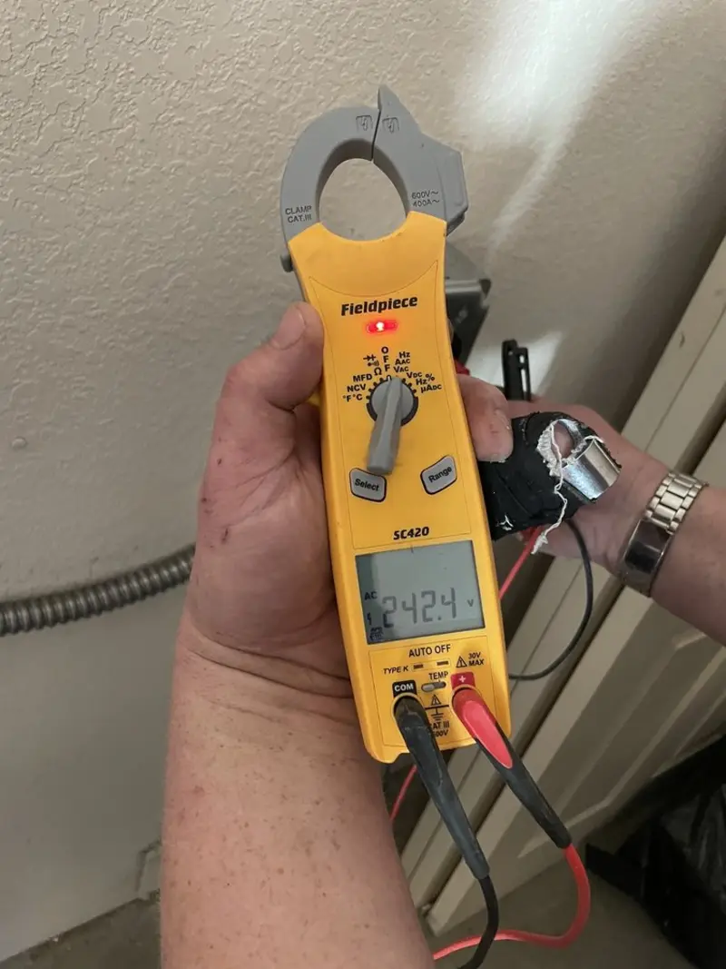 Voltage testing with clamp meter during Electrical Installation Services in Runnemede